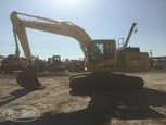 Side of used Excavator in yard